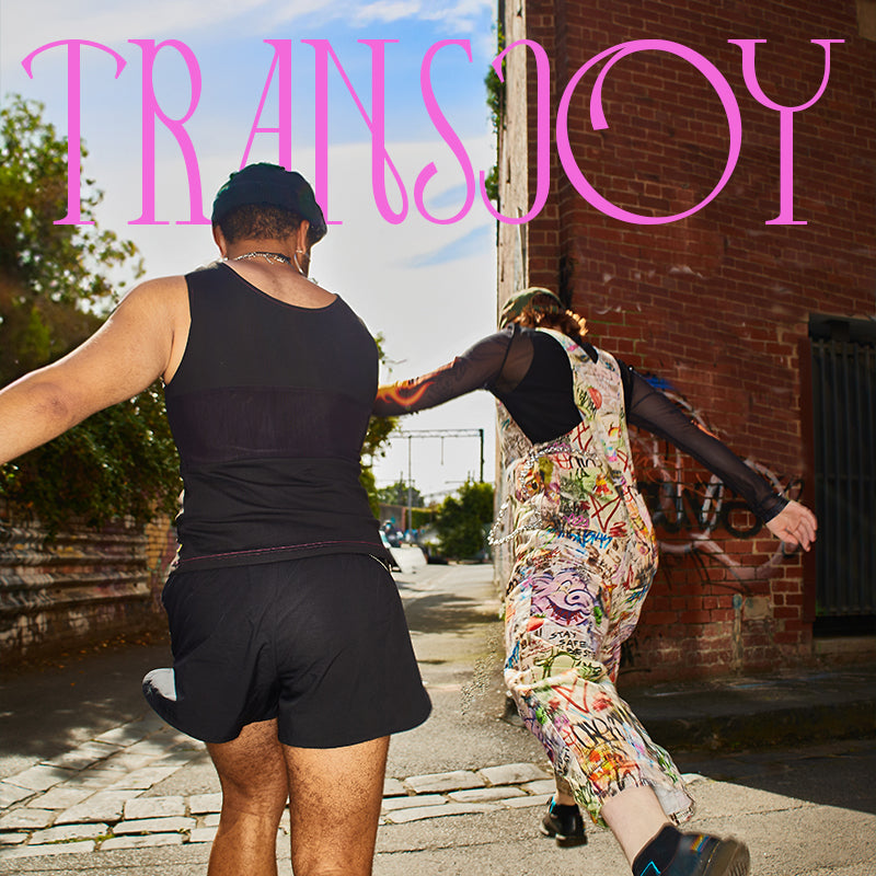 Image of 2 people holding hands with the words 'Trans Joy'