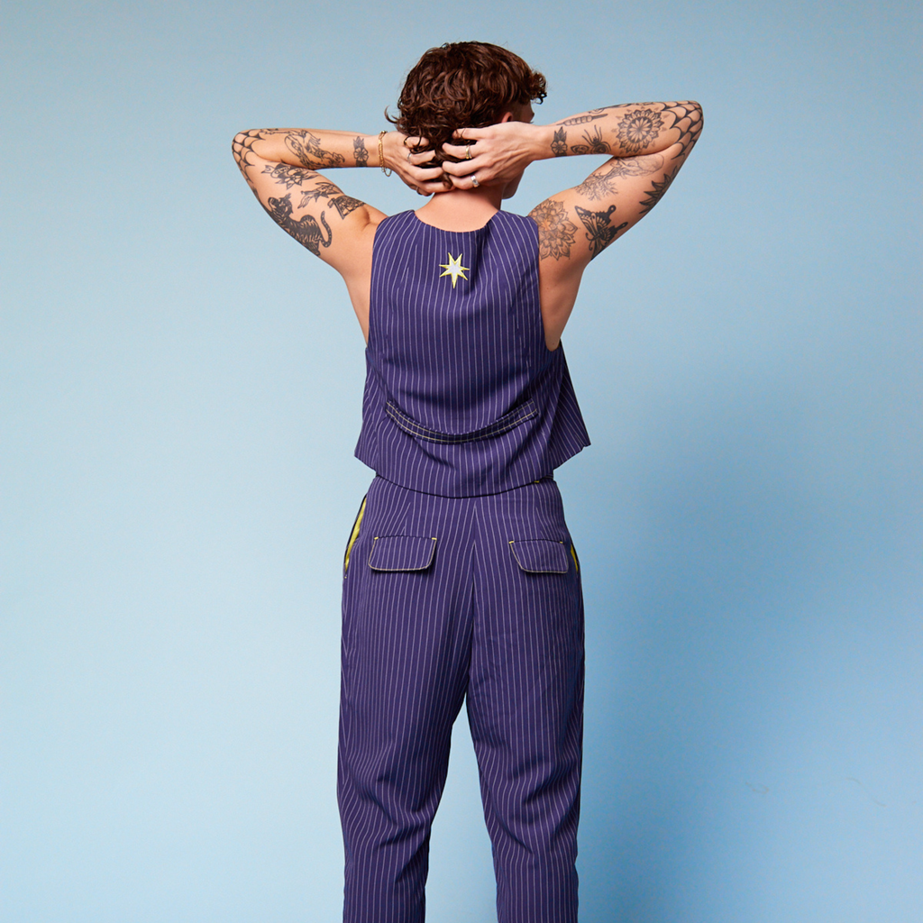 Tilly Lucas-Rodd wearing our Tripp Pants and vest - back view. Transform Transwear