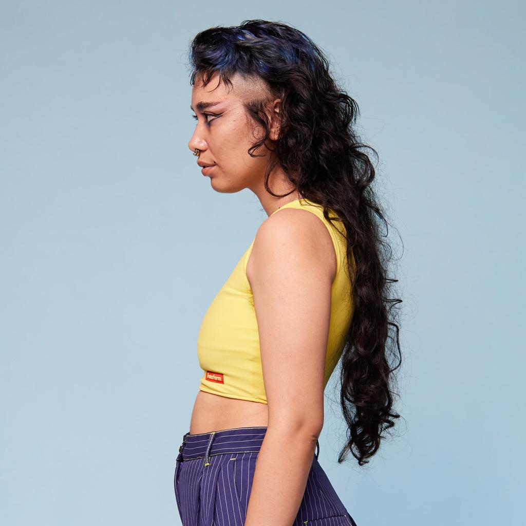 Model wearing Chest Binder Limoncello - side view