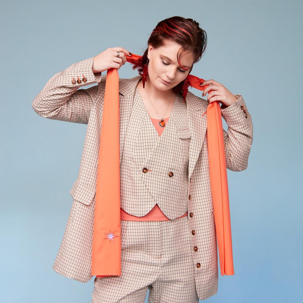 Model wearing scarf in Peach - front view