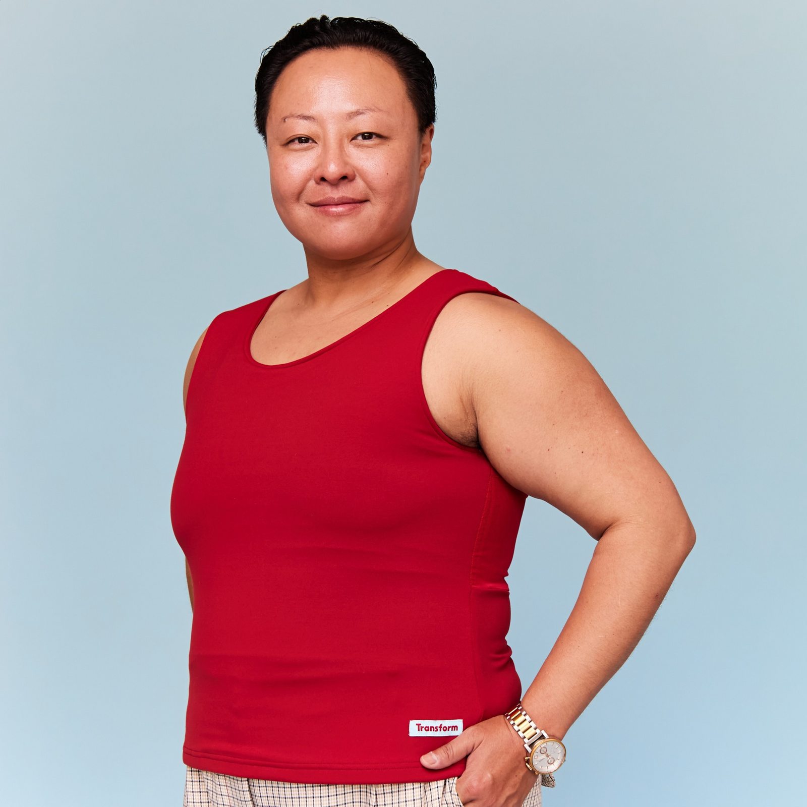 Model wearing a red chest binder