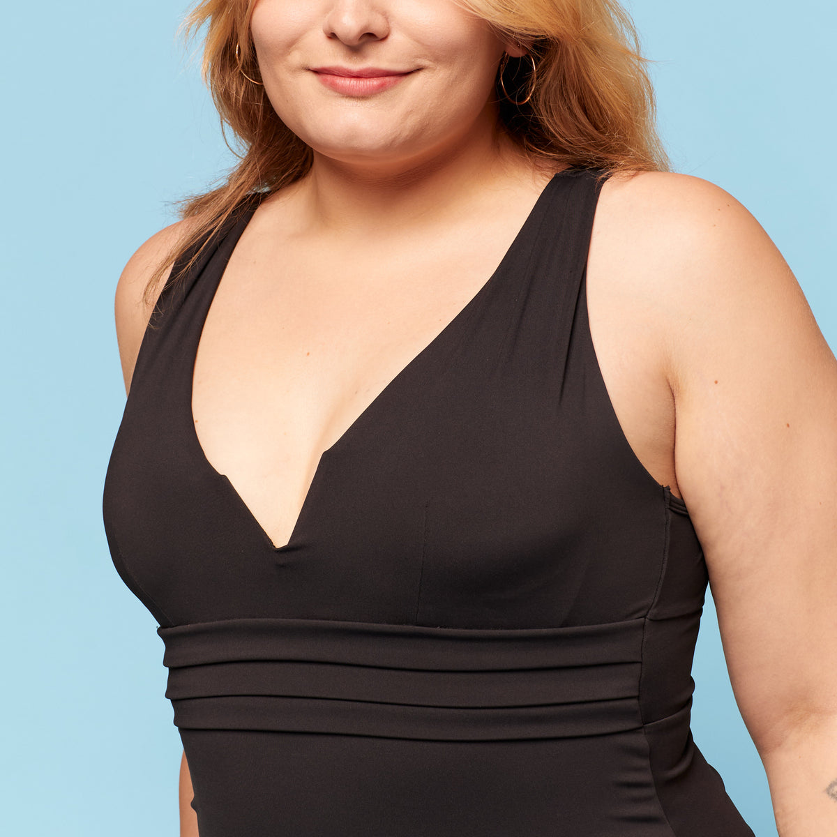 Close up of Model wearing trans femme tankini swim top