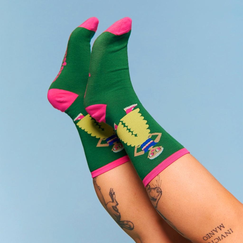 Model wearing a pair of pride socks