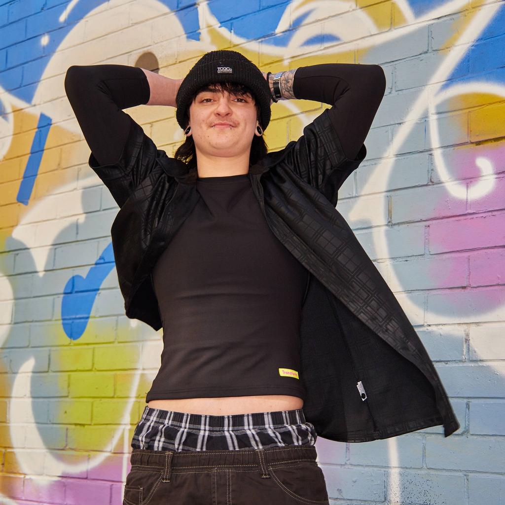 Cole styling our long sleeve compression shirt made from premium, breathable compression fabric - front view