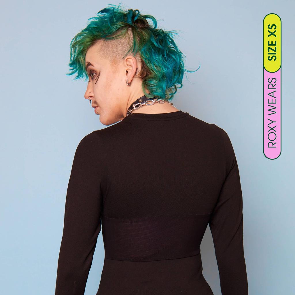 Roxy wearing long sleeve compression shirt made from premium, breathable compression fabric - back view