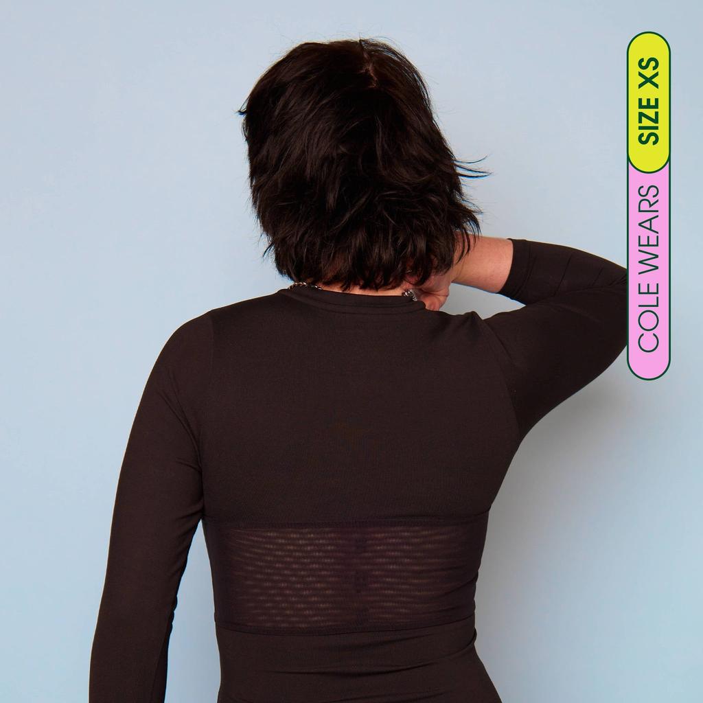 Cole wearing long sleeve compression shirt made from premium, breathable compression fabric - back view showing breathable panel