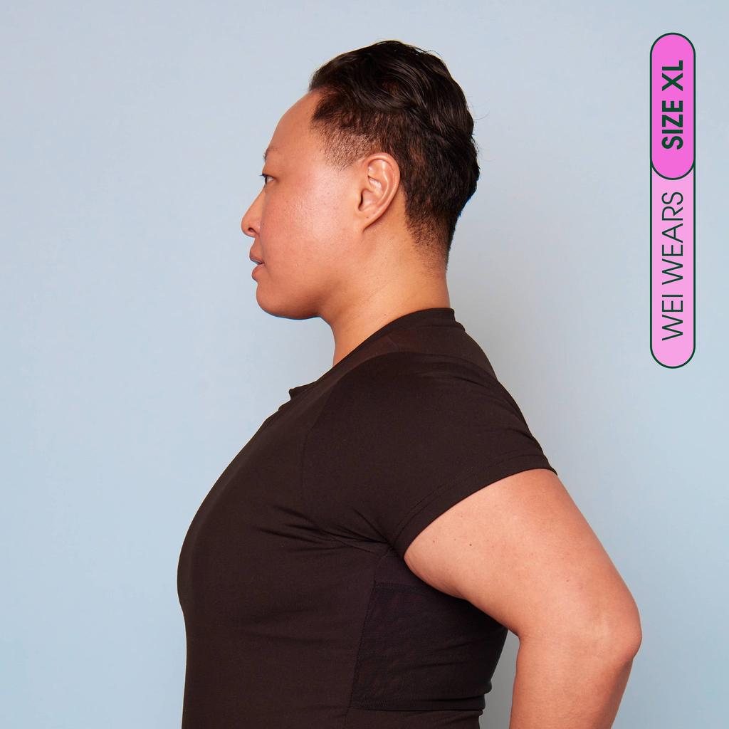 Wei wears size XL Compression T-Shirt - side view showing flattening effect